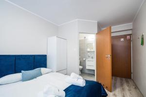 Posteľ alebo postele v izbe v ubytovaní Hotel Nowa Panorama