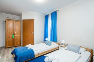 Posteľ alebo postele v izbe v ubytovaní Hotel Nowa Panorama