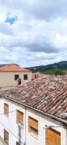 a view of the roofs of two buildings at Apartamentos cañamares in Cañamares