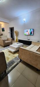 TV a/nebo společenská místnost v ubytování TUT's Place 10