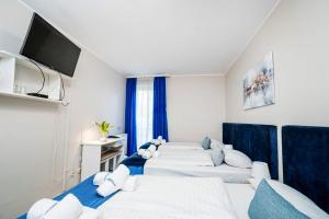 Posteľ alebo postele v izbe v ubytovaní Hotel Nowa Panorama