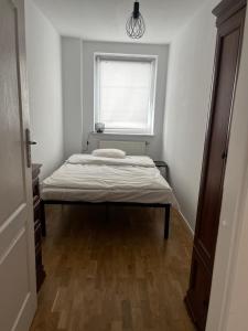 Posteľ alebo postele v izbe v ubytovaní Apartamenty Centrum