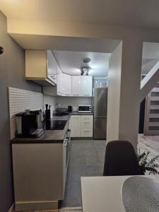Kuchyň nebo kuchyňský kout v ubytování Apartament Z Widokiem Na Wieżę