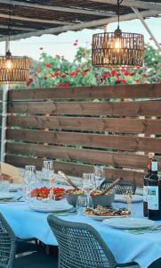 a table with plates of food on it with lights at Nereid Bungalow in Fánai +31 photos