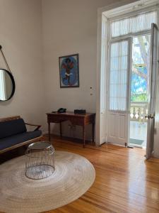 a living room with a couch and a table at Casa Moctezuma in Mexico City