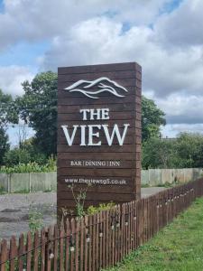 a sign for the view bar drinking inn at Willow Lodge In Hexton in Hexton