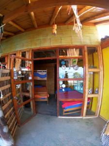an inside view of a house with wooden walls at Hotel Relajate in Lobitos