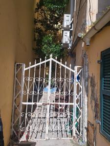 a gate in the side of a building at Deppy's Two-storey House in Corfu