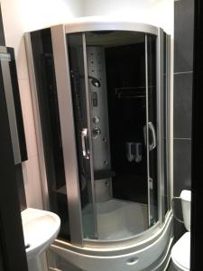 a bathroom with a shower and a sink at All Apartments City in Dnipro +66 photos