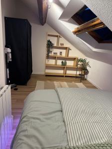 Ένα ή περισσότερα κρεβάτια σε δωμάτιο στο Appartement Dijon-centre quartier Montchapet