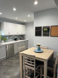 a kitchen with a table and chairs in a kitchen at The Moravian in Allentown