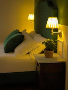 Postel nebo postele na pokoji v ubytování Putechella Retro Rooms & Villa