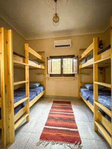 Postel nebo postele na pokoji v ubytování Tecoma Hostel