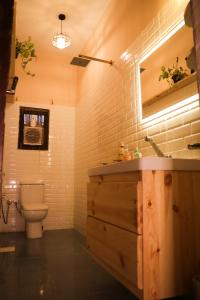 a bathroom with a toilet and a sink at Tecoma Hostel in Dahab +39 photos