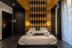 Maximum hub suite&spa tesisinde bir odada yatak veya yataklar