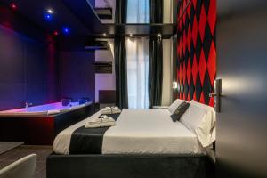 Maximum hub suite&spa tesisinde bir odada yatak veya yataklar