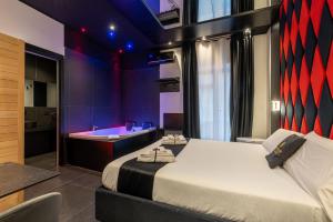 Maximum hub suite&spa tesisinde bir odada yatak veya yataklar