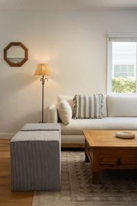 a living room with a couch and a table at Carlsbad Cottage - Remodeled in Carlsbad