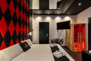 Maximum hub suite&spa tesisinde bir odada yatak veya yataklar