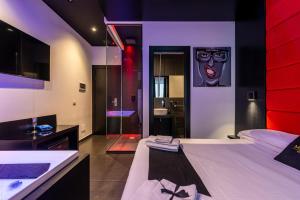 Maximum hub suite&spa tesisinde bir odada yatak veya yataklar