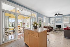 a kitchen and living room with a couch and a table at The Cottontail - 6 Meadowview Lane in Cherry Valley