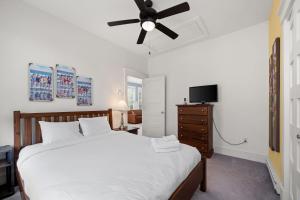 a bedroom with a bed and a ceiling fan at The Cottontail - 6 Meadowview Lane in Cherry Valley