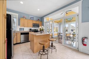 a kitchen and dining room with a table and chairs at The Cottontail - 6 Meadowview Lane in Cherry Valley