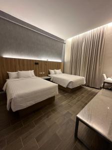 Postel nebo postele na pokoji v ubytování Hotel Soretti