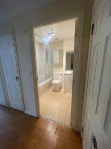 a bathroom with a shower and a toilet in a room at Gatwick 1 Bedroom Apartment in Chipstead