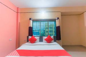 Postel nebo postele na pokoji v ubytování Hotel O Avigna Residency