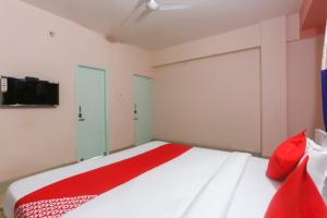 Postel nebo postele na pokoji v ubytování Hotel O Avigna Residency