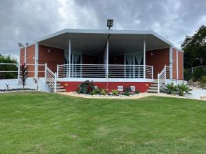 a large building with a large lawn in front of it at Mirada al Mar 01 in Camaceyes