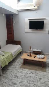 En eller flere senge i et værelse på Doña Rita departamentos