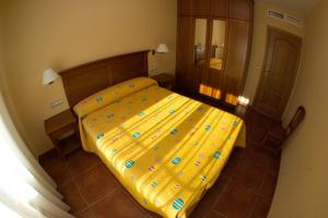 Postel nebo postele na pokoji v ubytování Apartamentos Turmo