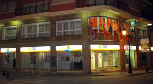 a building on the side of a street at night at Sol Mediterraneo in Archena
