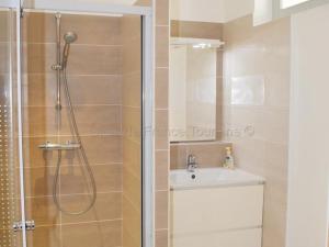 a bathroom with a shower and a sink at Gîte au Cœur du Val de Loire avec WIFI et Animaux Acceptés - FR-1-381-154 in Limeray +18 photos