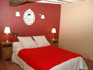 a red bedroom with a bed with a red wall at Gîte calme au cœur de vignoble bio avec piscine, proche Azay-le-Rideau - FR-1-381-238 in Brizay