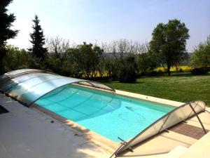 a swimming pool in a yard with at Charmante demeure 17e avec piscine privative, grand jardin et patrimoine riche en Touraine Sud. - FR-1-381-368 in Abilly-Sur-Claise