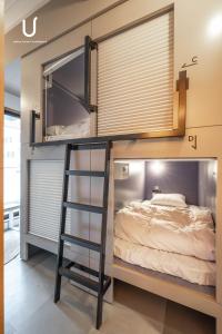 Postel nebo postele na pokoji v ubytování Hotel Residence Asakusa by unito