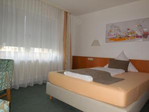 Postel nebo postele na pokoji v ubytování Hotel Schober