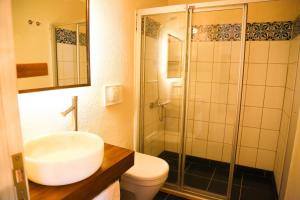 a bathroom with a toilet and a sink and a shower at Dardanos Hotel in Patara