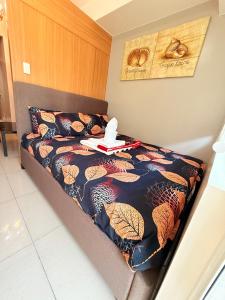 a bed with a tray on top of it at Shell Residences Condotel by PauL in Manila +57 photos
