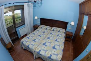 Postel nebo postele na pokoji v ubytování Apartamentos Turmo
