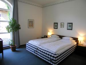 Łóżko lub łóżka w pokoju w obiekcie Falderhof