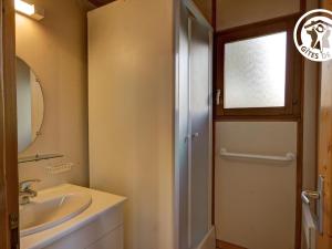 a bathroom with a sink and a mirror at Chalet authentique avec terrasse, animaux acceptés - FR-1-496-242 in Saint-Rirand