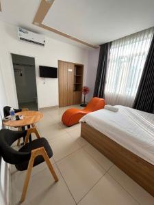 Postel nebo postele na pokoji v ubytování Hà Linh Hotel Vũng Tàu
