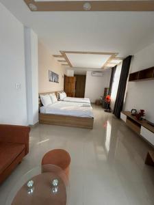 Postel nebo postele na pokoji v ubytování Hà Linh Hotel Vũng Tàu