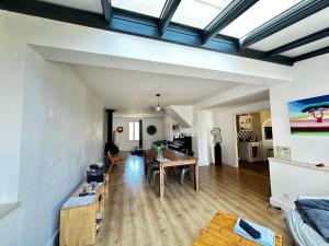 a living room with a couch and a table at Spacieuse Maison 4 Chambres, Centre Fouras, Proche Plages - FR-1-709-96 in Fouras