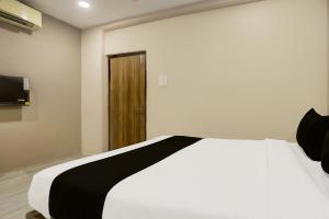 Postel nebo postele na pokoji v ubytování Super Hotel O Luxe Villa