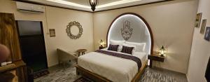 a hotel room with a bed with an archigunigunigunigunigun at Al Mare Karimunjawa in Karimunjawa